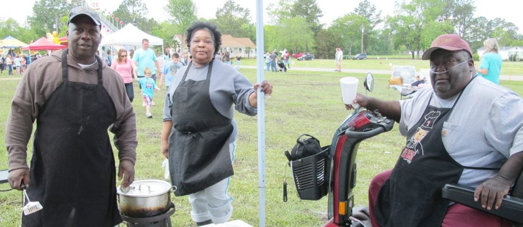 Farm Life School alumni Horace Mitchell, Margaret Jones, and Robert Baker volunteered for Deliverance Temple's fundraiser. Saturday, May 7, 2016.